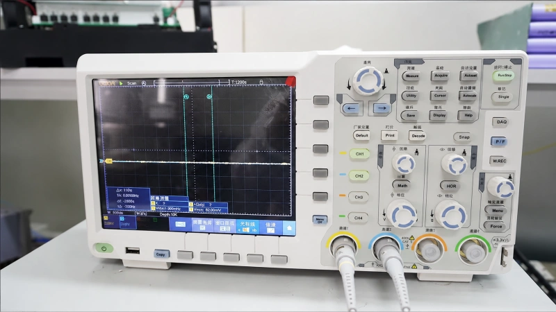 Electronic functional testing oscilloscope used for signal measurement and product verification.