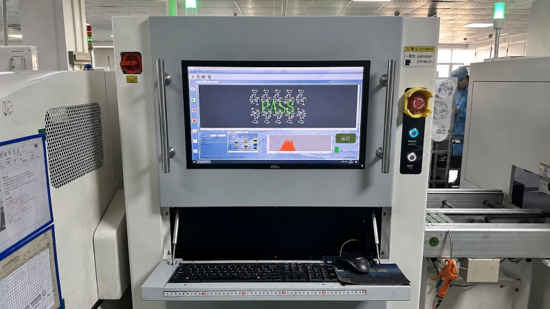 AOI inspection machine checking electronic components and confirming product quality.